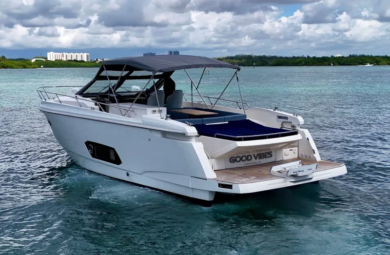  Yacht Photos Pics Luxury Absolute 40 yacht cruising on clear waters, 2014 model, with "Good Vibes" on the stern.