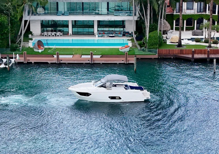  Yacht Photos Pics Luxurious Absolute 40 yacht cruising near waterfront mansion with pool, 2014 model.
