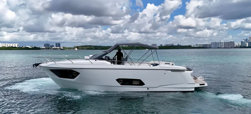  Yacht Photos Pics Luxury Absolute 40 yacht cruising on clear waters under a partly cloudy sky, 2014 model.