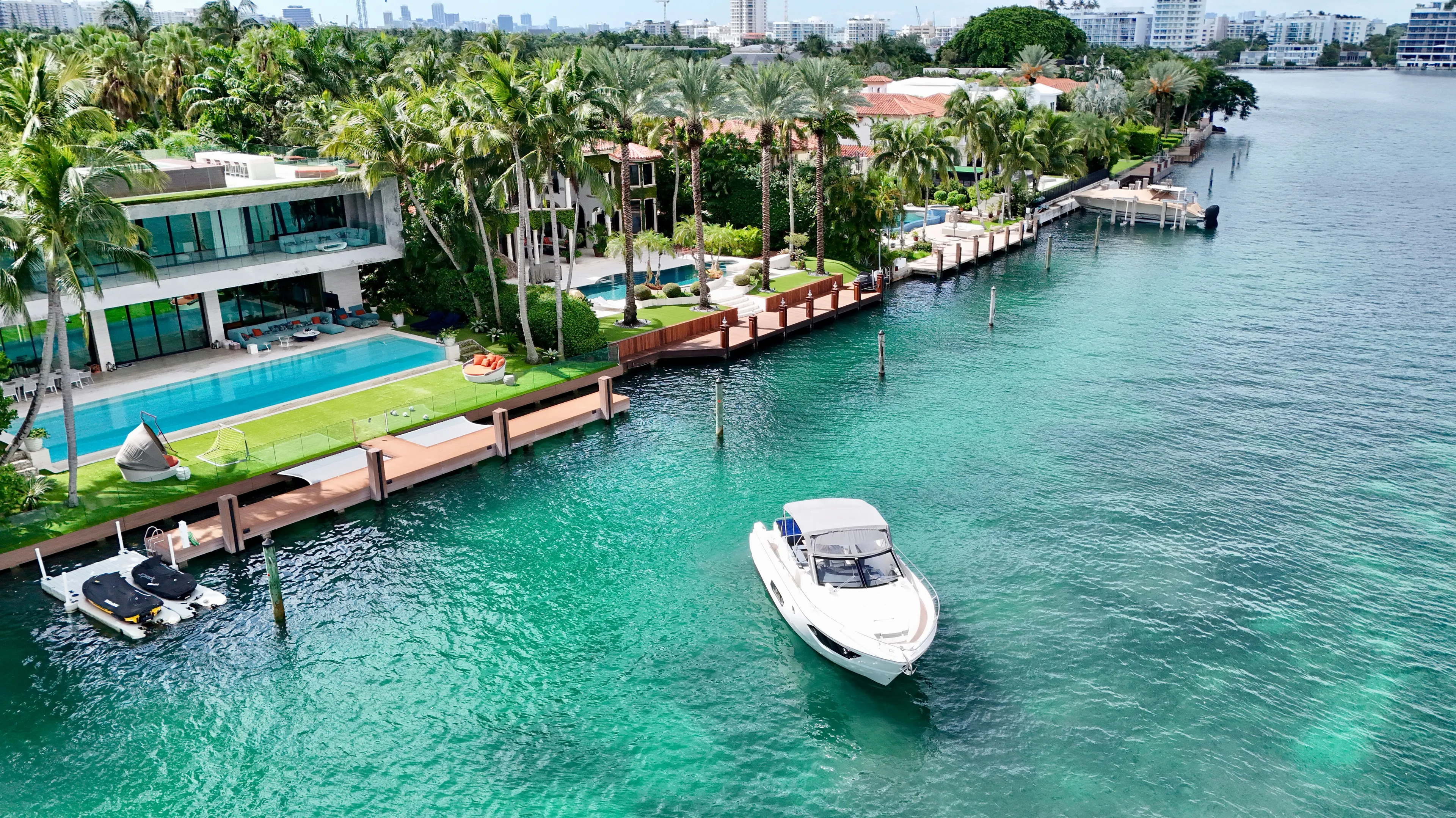  Yacht Photos Pics Luxurious waterfront property with a 2014 Absolute 40 yacht on turquoise waters.