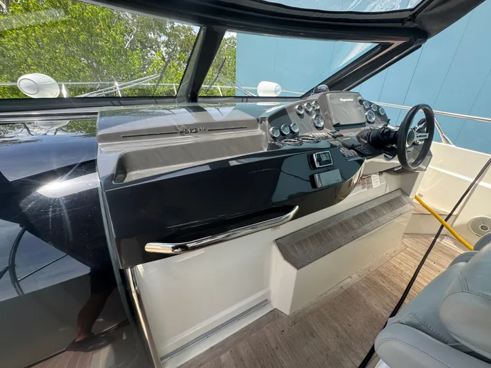  Yacht Photos Pics Helm of 2014 Absolute 40 yacht with modern controls and steering wheel.