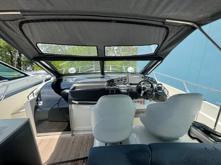  Yacht Photos Pics Interior view of 2014 Absolute 40 yacht cockpit with dual seats and modern controls.