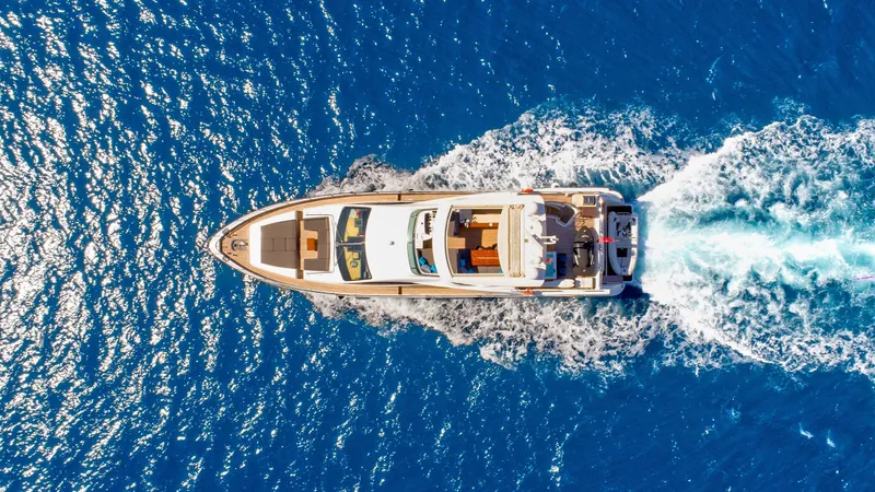 Hubo Yacht Photos Pics Aerial view of 2016 Azimut 84 yacht cruising on vibrant blue ocean waters.