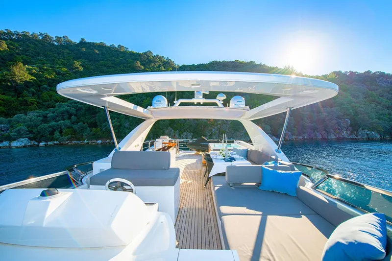 Hubo Yacht Photos Pics Luxurious 2016 Azimut 84 yacht deck with scenic ocean and forest backdrop.