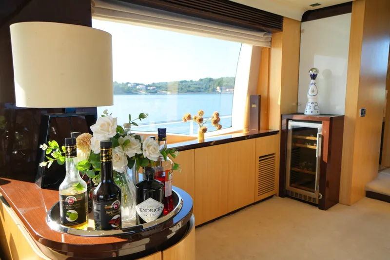 Hubo Yacht Photos Pics Luxurious interior of 2016 Azimut 84 yacht with bar and scenic window view.