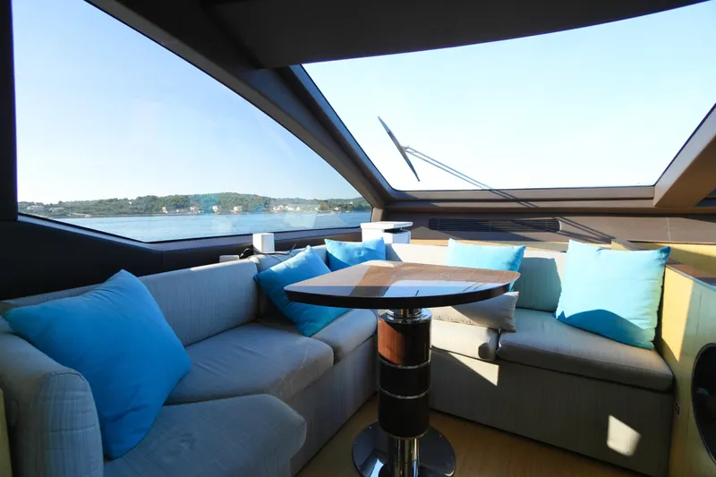Hubo Yacht Photos Pics Luxurious interior of 2016 Azimut 84 yacht with plush seating and scenic window view.