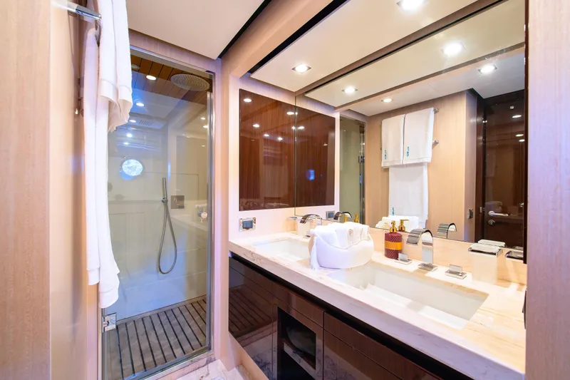 Hubo Yacht Photos Pics Luxurious bathroom in 2016 Azimut 84 yacht with modern fixtures and spacious shower.