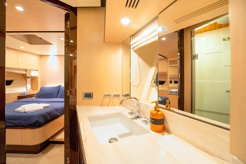 Hubo Yacht Photos Pics Luxurious interior of 2016 Azimut 84 yacht featuring elegant bedroom and bathroom.