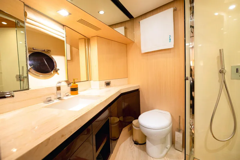 Hubo Yacht Photos Pics Luxurious bathroom on a 2016 Azimut 84 yacht with modern fixtures and elegant design.