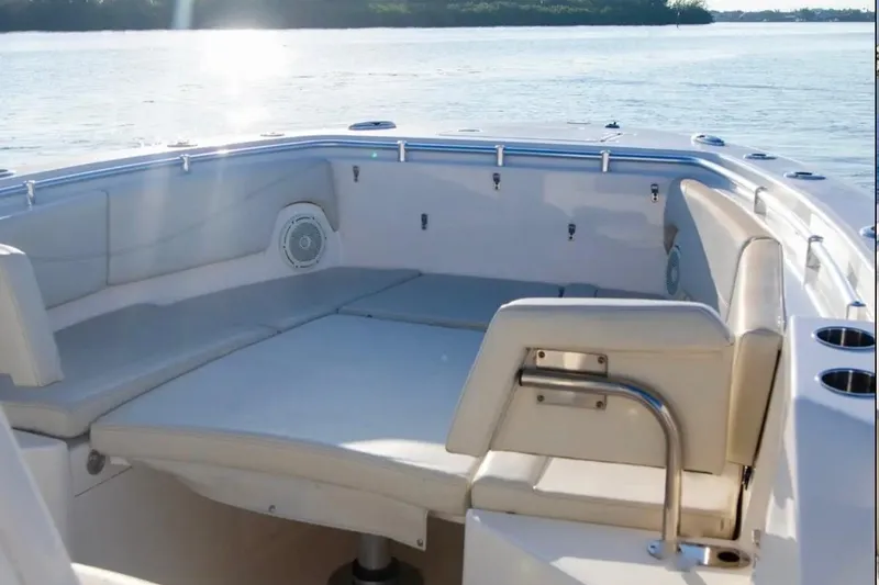  Yacht Photos Pics 2018 Cobia 320 Center Console boat interior with cushioned seating and cup holders.