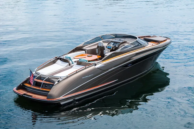 La Sirena Yacht Photos Pics 2014 Riva Rivarama luxury yacht on calm water, showcasing sleek design and elegance.