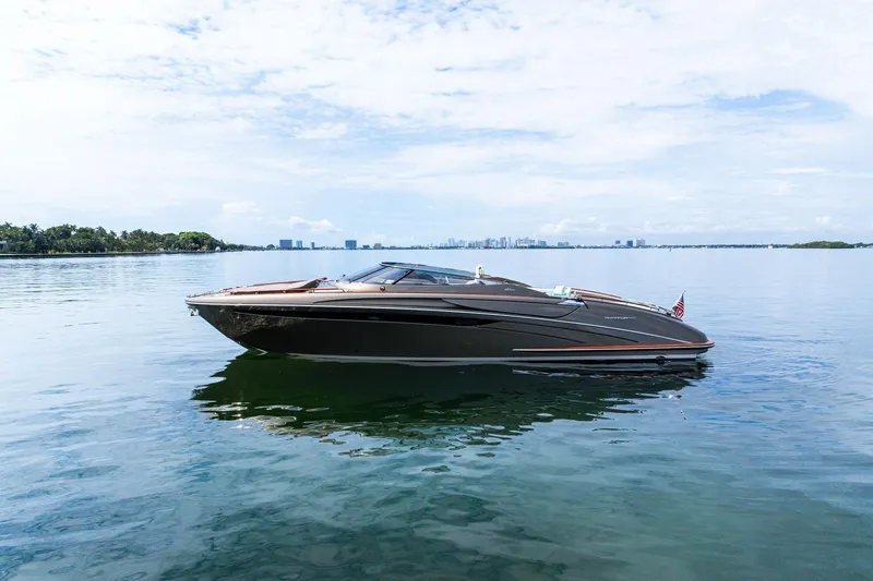 La Sirena Yacht Photos Pics 2014 Riva Rivarama luxury yacht on calm water under a clear sky.