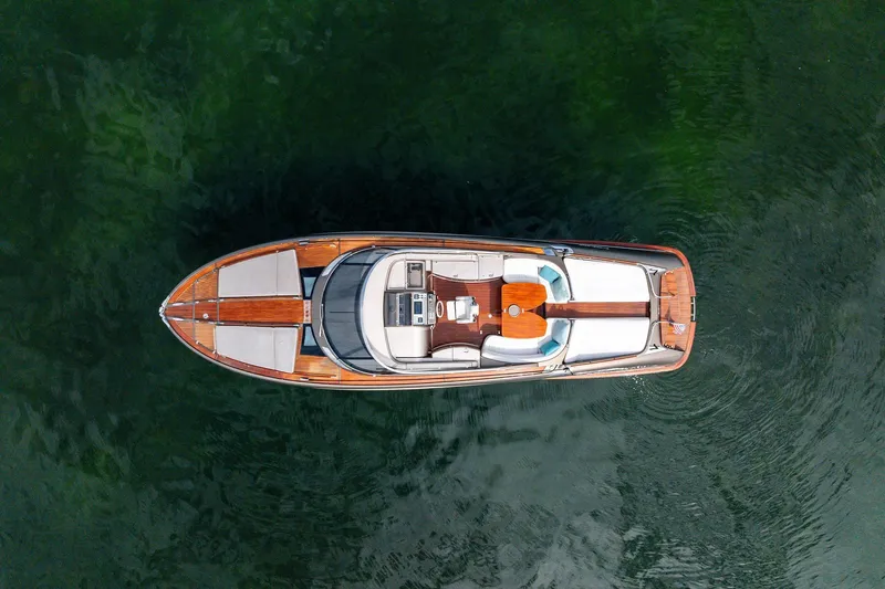 La Sirena Yacht Photos Pics Aerial view of 2014 Riva Rivarama luxury yacht on calm water.