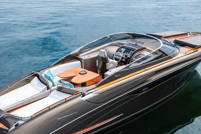 La Sirena Yacht Photos Pics 2014 Riva Rivarama luxury yacht on calm blue water, featuring sleek design and elegant interior.