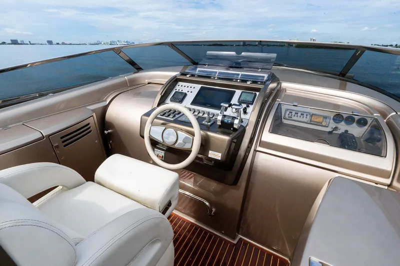 La Sirena Yacht Photos Pics 2014 Riva Rivarama yacht cockpit with modern controls and luxurious seating.