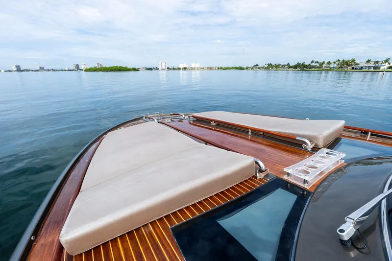 La Sirena Yacht Photos Pics Luxurious 2014 Riva Rivarama yacht with sleek deck design on calm waters.