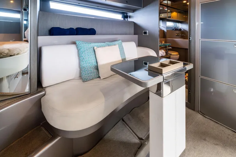 La Sirena Yacht Photos Pics Luxurious interior of a 2014 Riva Rivarama yacht with modern seating and table.