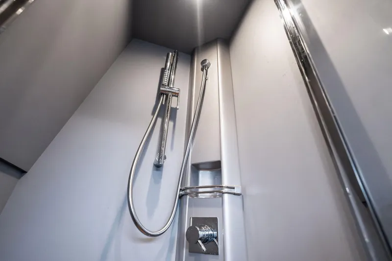 La Sirena Yacht Photos Pics Shower area in 2014 Riva Rivarama yacht, featuring modern chrome fixtures.