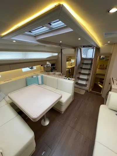 Genesis Yacht Photos Pics Luxurious interior of a 2021 Jeanneau 54 yacht with elegant seating and modern design.