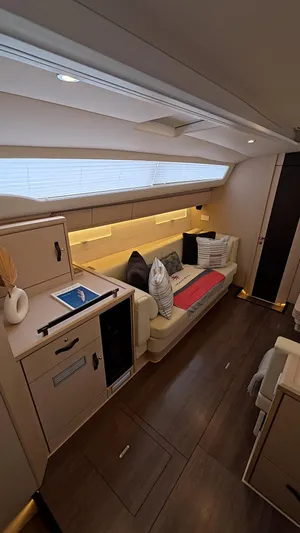 Genesis Yacht Photos Pics Luxurious interior of 2021 Jeanneau 54 yacht with modern furnishings and ambient lighting.