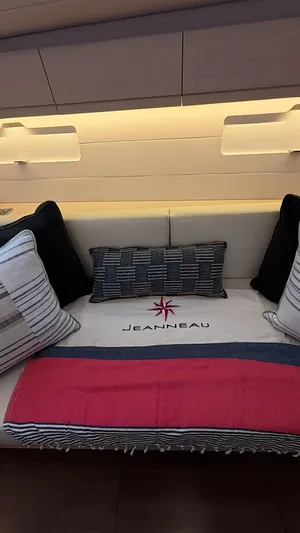 Genesis Yacht Photos Pics Interior of a 2021 Jeanneau 54 yacht with stylish cushions and branded decor.