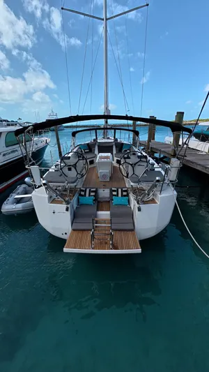Genesis Yacht Photos Pics 2021 Jeanneau 54 yacht docked, showcasing elegant design and spacious deck.