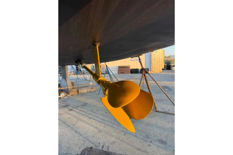 Genesis Yacht Photos Pics Yellow propeller of 2021 Jeanneau 54 sailboat on dry dock.