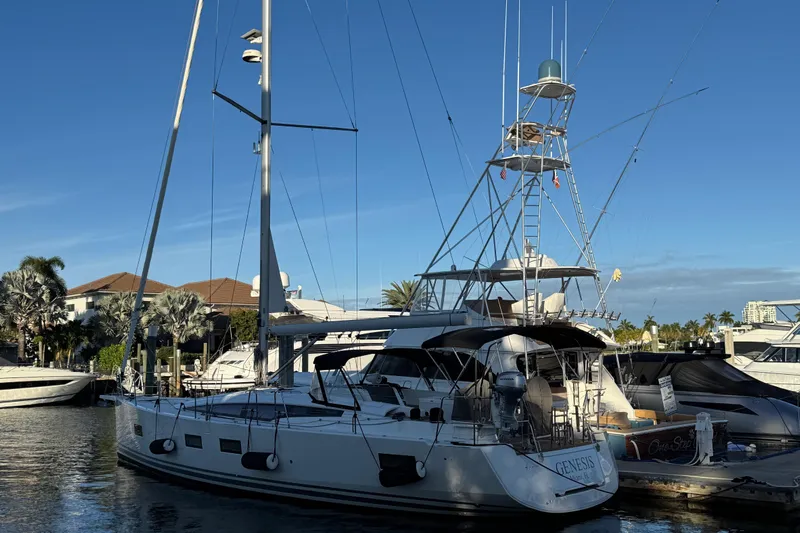 Genesis Yacht Photos Pics 2021 Jeanneau 54 yacht docked at marina under clear blue sky.