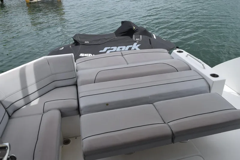 Insieme Yacht Photos Pics 2018 Cruisers Yachts 45 Cantius with gray seating and Sea-Doo Spark on water.