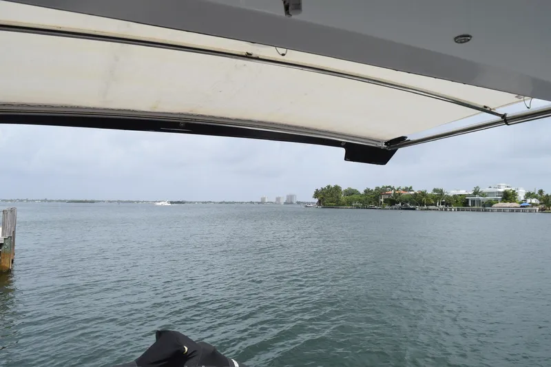 Insieme Yacht Photos Pics View from 2018 Cruisers Yachts 45 Cantius, overlooking calm waters and distant shoreline.