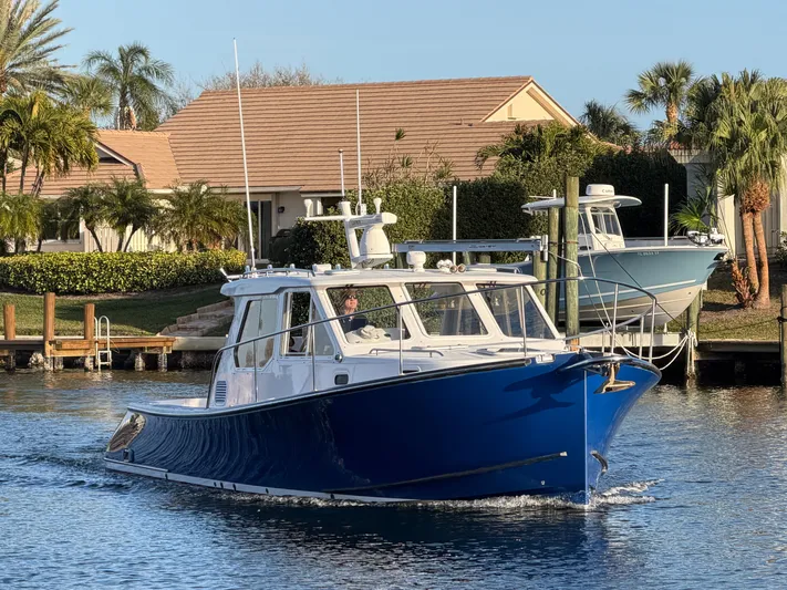 Ticklish Yacht Photos Pics True North 38 Heritage boat from 2002 on calm water.