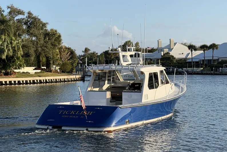 Ticklish Yacht Photos Pics True North 38 Heritage yacht from 2002 on a serene waterway.