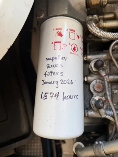 Ticklish Yacht Photos Pics Oil filter with maintenance notes, True North 38 Heritage, 2002.