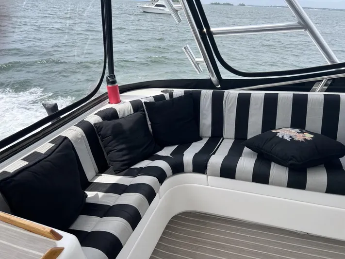 Necessity Yacht Photos Pics 2005 Albin 44 Command Bridge interior with striped seating and ocean view.