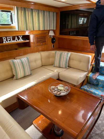 Necessity Yacht Photos Pics Luxurious interior of 2005 Albin 44 Command Bridge with cozy seating and elegant decor.