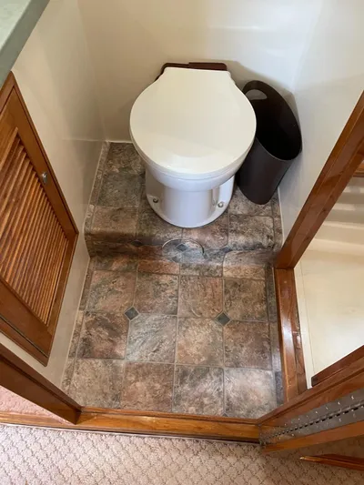 Necessity Yacht Photos Pics 2005 Albin 44 Command Bridge bathroom with tiled floor and compact toilet.