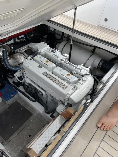 Necessity Yacht Photos Pics Engine compartment of a 2005 Albin 44 Command Bridge boat, featuring a Yanmar engine.