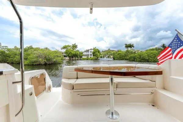 No Pods - V-drive Yacht Photos Pics Luxurious 2015 Sea Ray 510 Fly yacht with elegant seating and scenic water view.