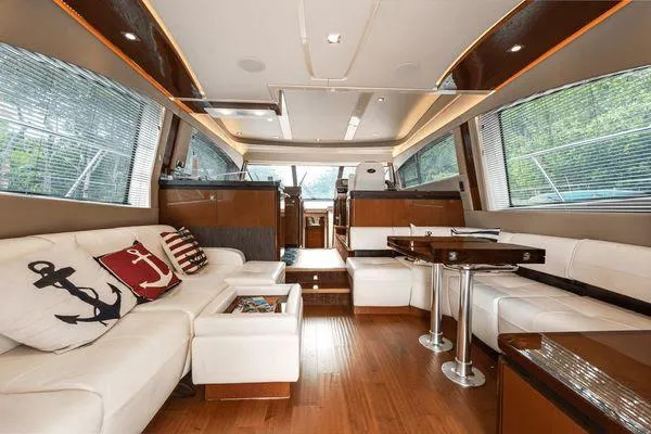 No Pods - V-drive Yacht Photos Pics Luxurious interior of 2015 Sea Ray 510 Fly yacht with elegant seating and nautical decor.