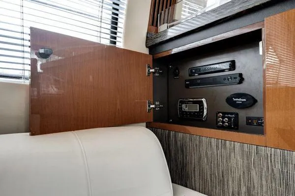 No Pods - V-drive Yacht Photos Pics 2015 Sea Ray 510 Fly yacht interior with open cabinet revealing electronic equipment.