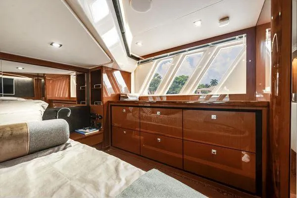 No Pods - V-drive Yacht Photos Pics Luxurious interior of 2015 Sea Ray 510 Fly yacht with elegant wood cabinetry and large windows.