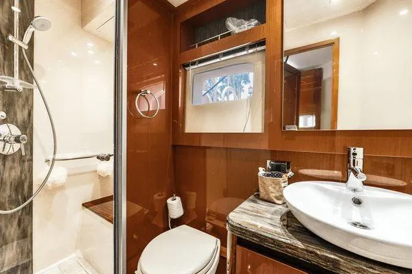 No Pods - V-drive Yacht Photos Pics Luxurious bathroom in 2015 Sea Ray 510 Fly yacht with modern fixtures and elegant design.