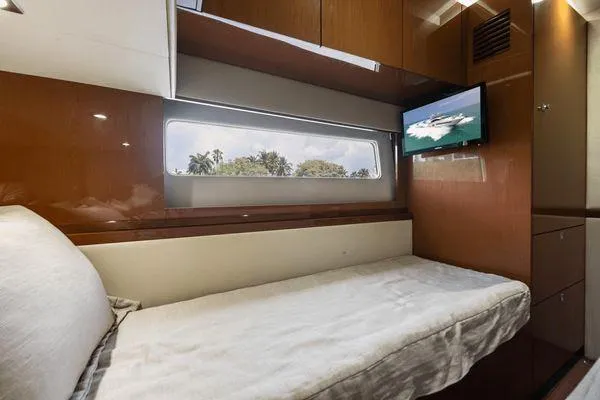 No Pods - V-drive Yacht Photos Pics Luxurious cabin interior of 2015 Sea Ray 510 Fly yacht with bed and window view.