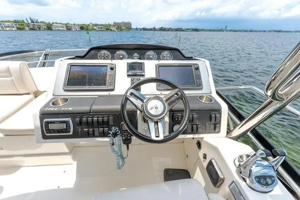 No Pods - V-drive Yacht Photos Pics Cockpit of 2015 Sea Ray 510 Fly yacht with steering wheel and navigation screens.
