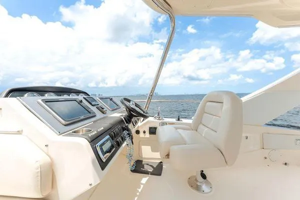 No Pods - V-drive Yacht Photos Pics 2015 Sea Ray 510 Flybridge helm with luxurious seating and ocean view.