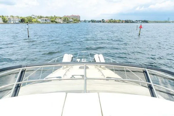 No Pods - V-drive Yacht Photos Pics Bow view of 2015 Sea Ray 510 Fly yacht cruising on a calm waterway.