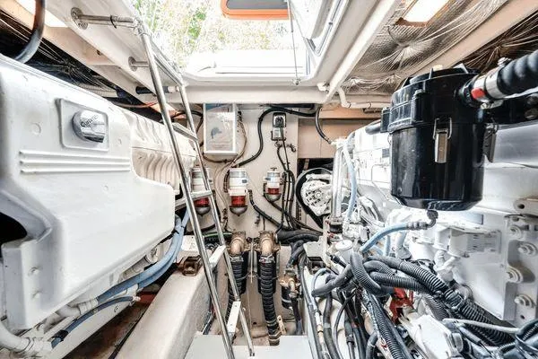No Pods - V-drive Yacht Photos Pics Engine room of 2015 Sea Ray 510 Fly yacht, showcasing mechanical components and wiring.