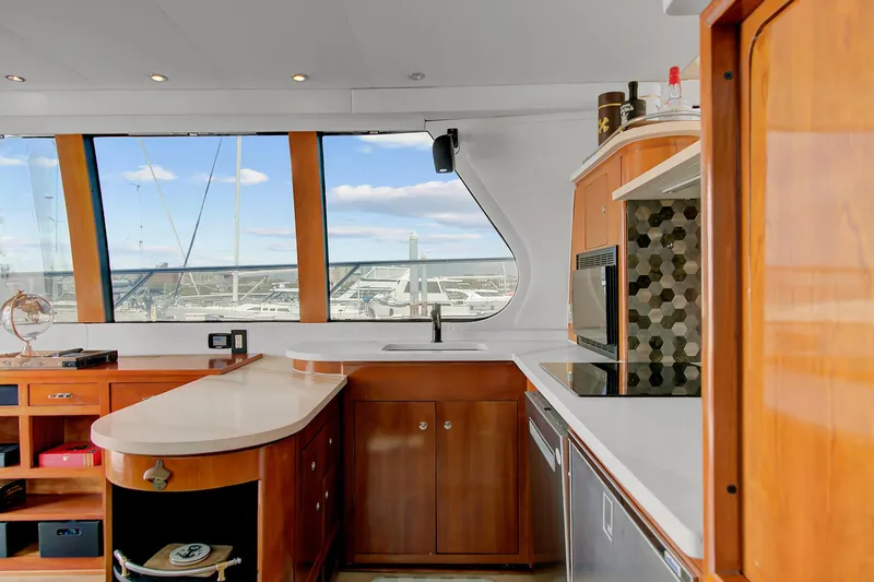 No Surrender Yacht Photos Pics Luxurious kitchen interior of 2000 Carver 530 Voyager Pilothouse yacht with modern amenities.