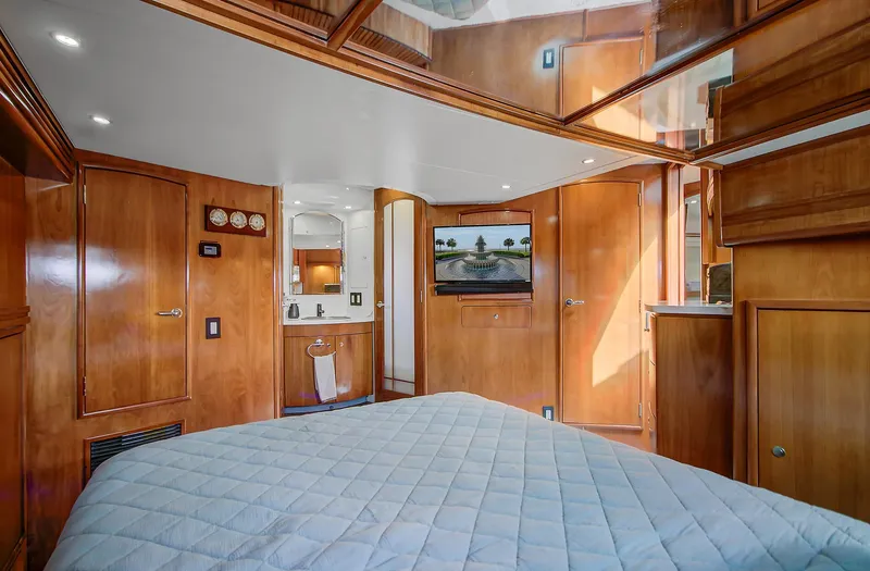 No Surrender Yacht Photos Pics Luxurious interior of 2000 Carver 530 Voyager Pilothouse with wood paneling and modern amenities.