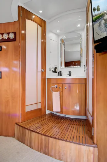 No Surrender Yacht Photos Pics Interior of 2000 Carver 530 Voyager Pilothouse with wooden cabinetry and modern fixtures.